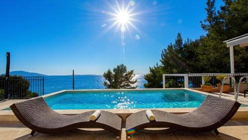 Martinscica Villa | Villa St Martin-Reef - Exclusive Seafront Villa with Private Heated Pool