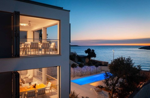 Sevid Villa | Beachside Villa Oro - on the beach, with private MAGNA pool by MyWaycation