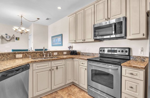 Yaupon Beach Condo | Beats Working: Condo with Community Pool Near OKI Pier and Restaurants