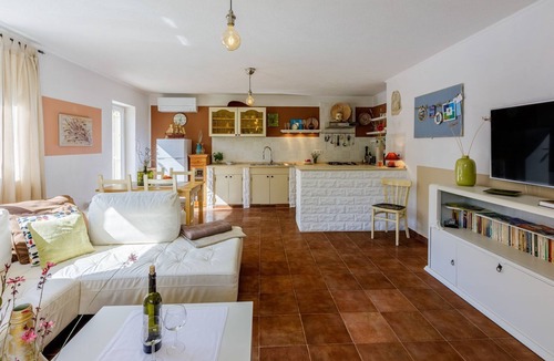 Tribalj Apartment | Charming apartment with Mediterranean garden, pool, high chair, cot, BBQ