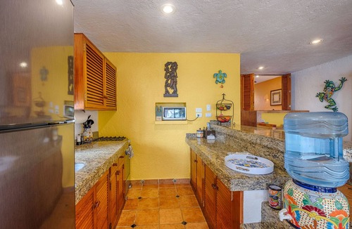Akumal Condo | Walk onto the white sandy beach of Half Moon Bay from your patio door!