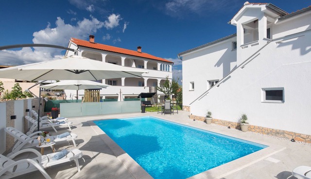 Apartment LiJan °1 with heated salt water pool, garden, children's playground