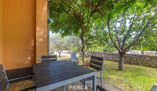 Apartment LYNA on the ground floor with garden in a quiet location 300m from the beach with crystal clear sea
