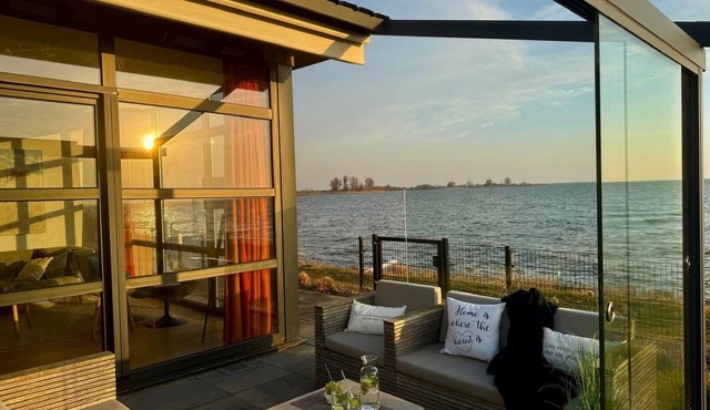 Beachfront Chalet with Fenced Garden and Exceptional Sea Views in Enkhuizen