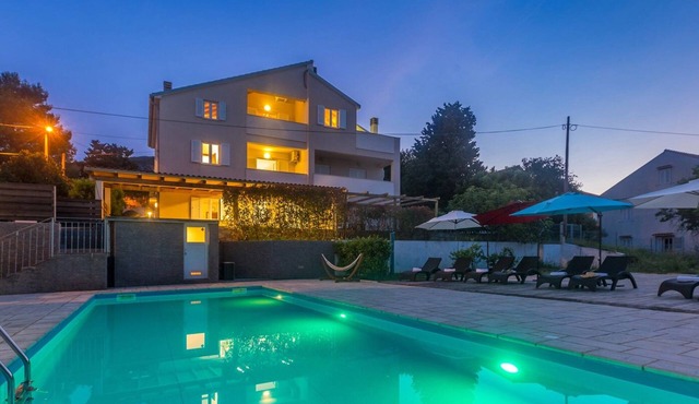 Holiday apartment MICHELLE with large heated pool 50m2 and sea view in Nerezine on the island of Lošinj