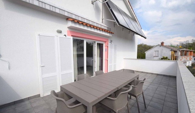 Holiday apartment with air conditioning and balcony