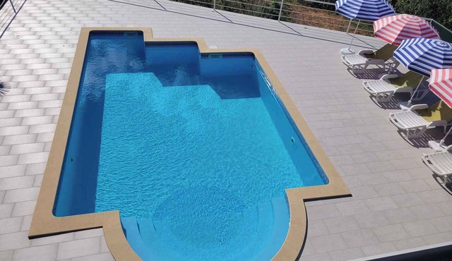 Holiday home with sea view and pool