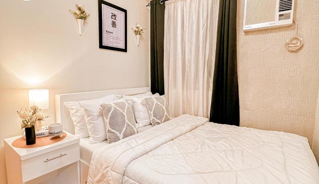 Kaizen Suites at Trees Residences - 2BR with PS4, Netflix, Disney plus, Unli Wifi and Popcorn