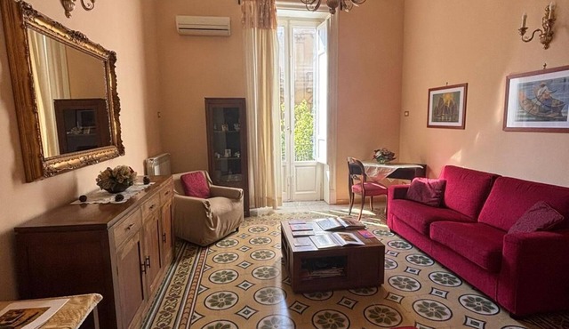 Large Art Nouveau dwelling in central Via Roma near major monuments