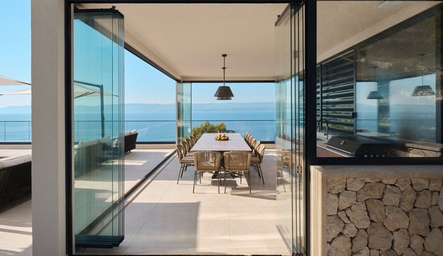 Luxurious Villa Deluxe Mimice by the sea with heated outdoor and indoor pools, sauna, and gym for 20 people.