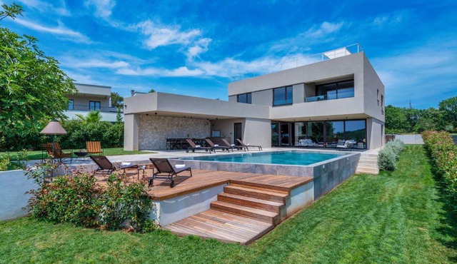 Luxury beachside villa with a pool and a sea view