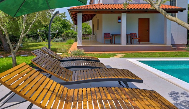 Modern house in a quiet location with a fenced garden, porch and private pool