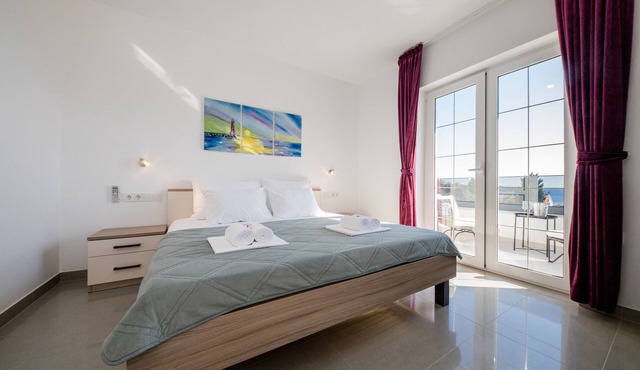 One bedroom apartment with balcony and sea view Banjol (Rab) (A-21635-c)