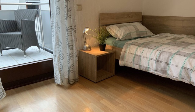 Room for fitters with shared bathroom and balcony