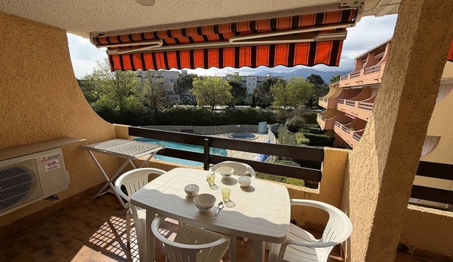 Spacious 2-BR Apartment, Pool View, 300m from Beach, A/C, Parking, Balcony, Elevator Access