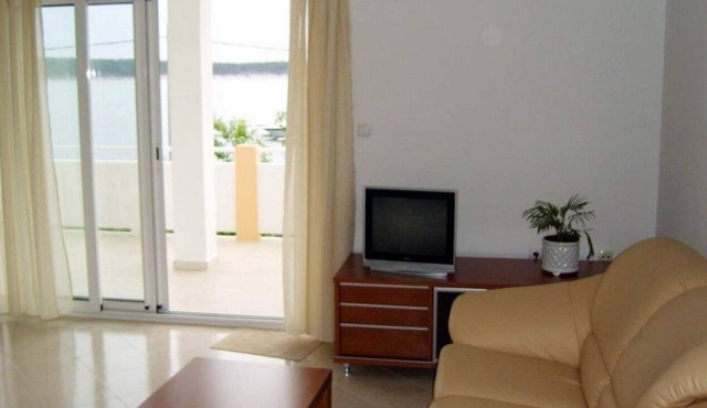 Two bedroom apartment with terrace and sea view Barbat, Rab (A-22053-a)