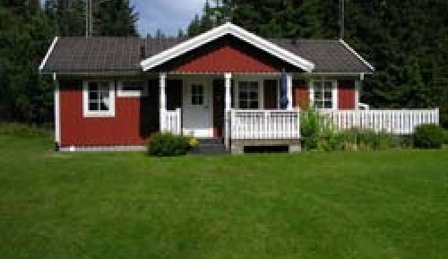 Typical red and white holiday home in the countryside in Småland