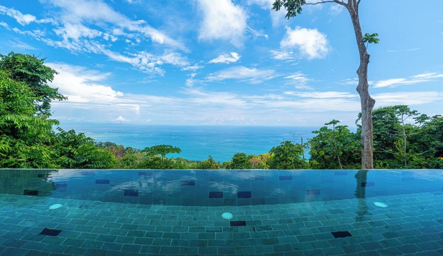 Wake up to the sounds of the jungle and dramatic views of the sea