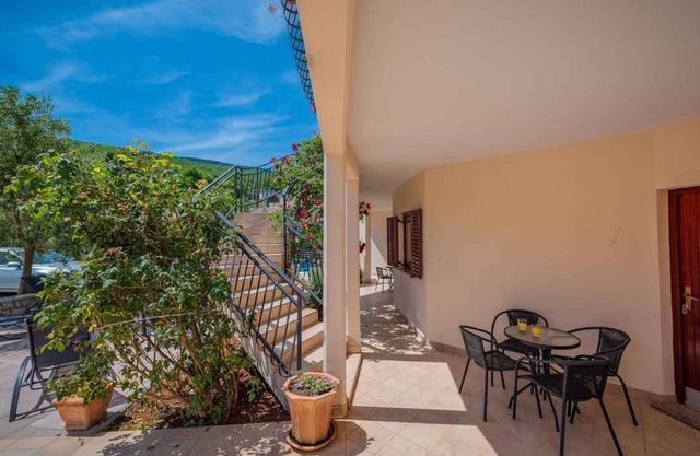 Holiday apartment with sea view and pool