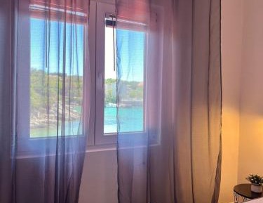 One-Bedroom Apartment with Balcony and Sea View